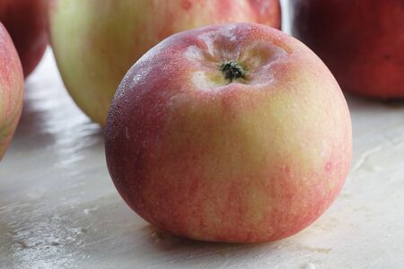 Apple on the white painted table