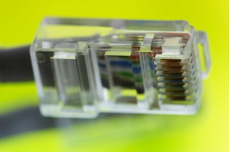 Old and dusty plug on the green backgroundの写真素材