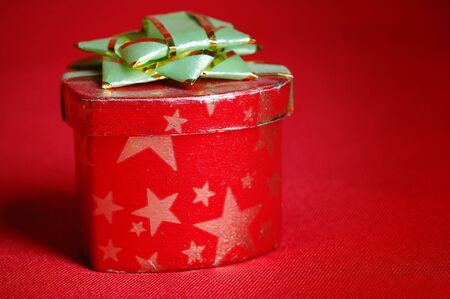 Red heart-shaped box on the red draperies.の写真素材