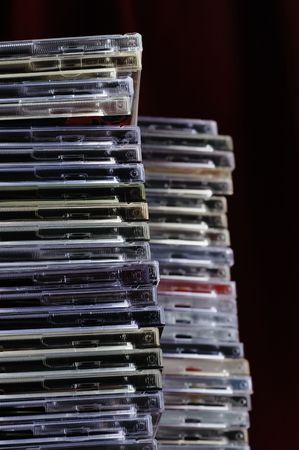 Big pile of old CD boxes. Used and dusty. Narrow depth of field.の写真素材