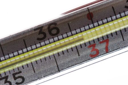 Mercury thermometer on the white background. Close-up.