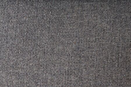 Grey sackcloth. Dusty and dirty. Close-up. Texture.