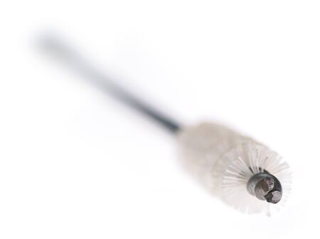 Small wire brush isolated on the white. Narrow depth of field. Old and used.