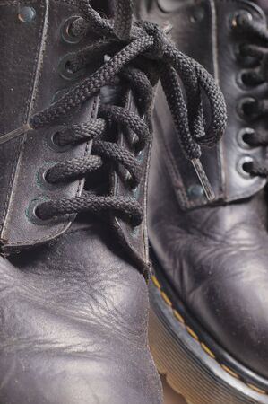 Old boots close-up. Old and dusty. Narrow depth of field.の写真素材