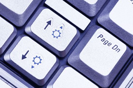 Notebook keyboard. Fragment. Close-up. Blue tint.の写真素材