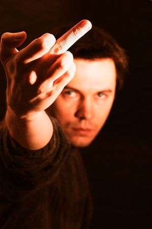 Aggressive men showing the middle finger. Focus on the hand.
