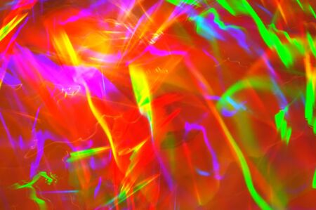 Spectrum colored reflection on the pile of dvd discs.の写真素材