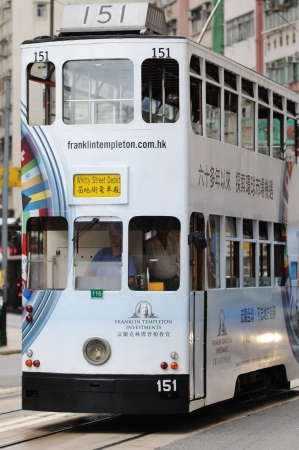HONG KONG - JULY 16: Double-decker tram on the street of Hong Kong. Hong Kong, China - July 16, 2011.のeditorial素材
