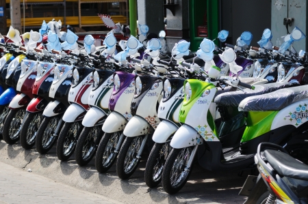 BANGKOK - SEPTEMBER 3: New scooters for sale in the shop on the street of Bangkok. Bangkok, Thailand - September 3, 2011.のeditorial素材