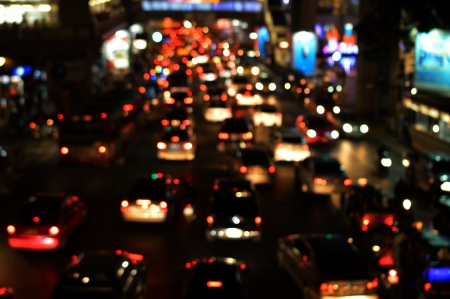 Bright circles from streetlamps and car s headlights on defocused photo of night street 