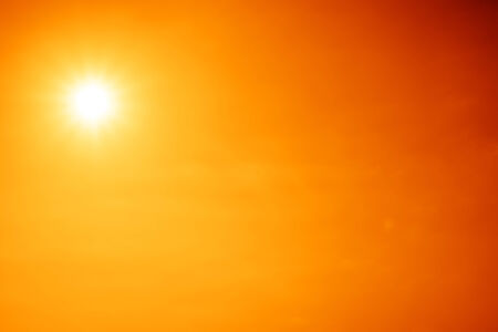 Bright sun shines in the sky.の写真素材