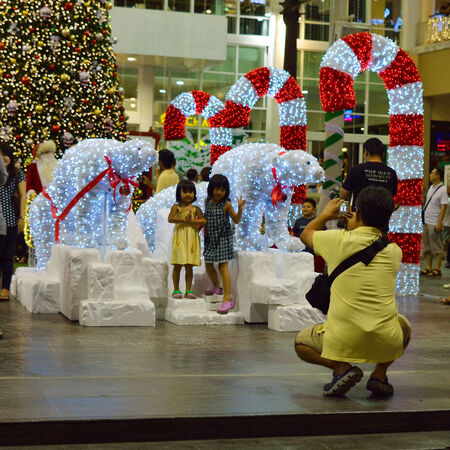 HUA HIN, THAILAND - DECEMBER 12: People make photo in cristmas decoration in Market Village. Hua Hin, Thailand - December 12, 2012.のeditorial素材