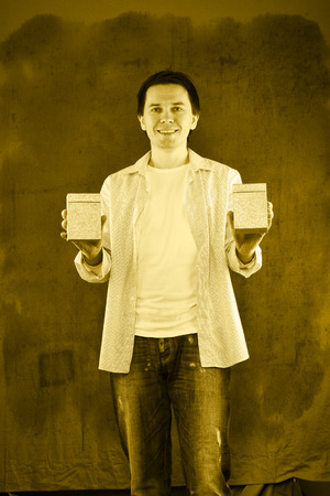 Man in white shirt posing in the studio.の写真素材