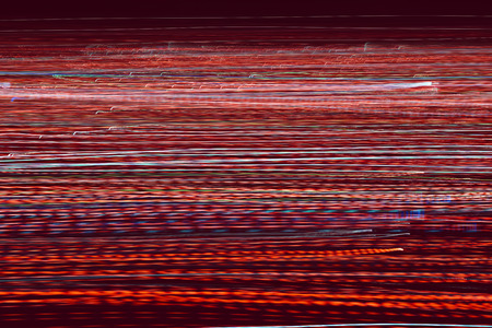 Abstract light trails. Motion blurred photo of night street.