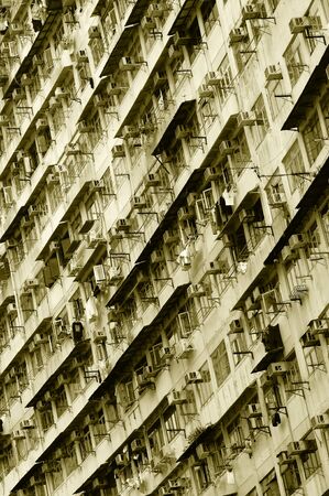 Big tenement-house wall in the Hong Kong. Sepia tint.の写真素材