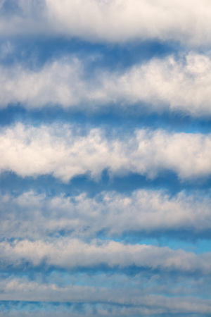 Striped clouds in the morning sky.