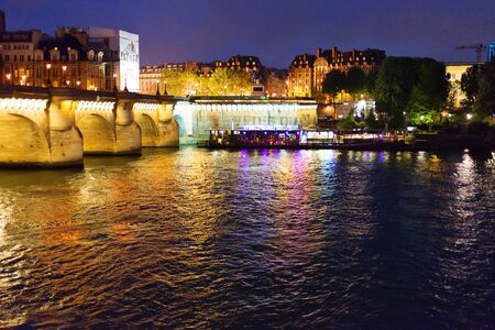 PARIS, FRANCE - MAY 9, 2016: Beautiful lights on the night streets of Paris in rainy weather.のeditorial素材