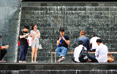 BANGKOK, THAILAND - AUGUST 16, 2016: Locals and tourists on noisy and colorful life-filled streets of Bangkok.のeditorial素材