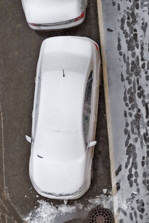 Snowbound car in snowfall time.の写真素材