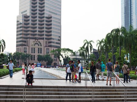 KUALA LUMPUR, MALAYSIA - AUGUST 18, 2016: Noisy and colorful life-filled streets of Kuala Lumpur.