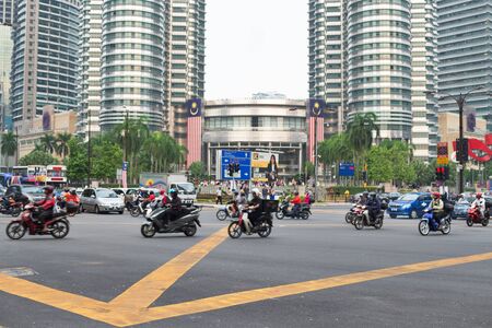 KUALA LUMPUR, MALAYSIA - AUGUST 18, 2016: Noisy and colorful life-filled streets of Kuala Lumpur.