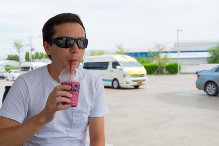 HUA HIN, THAILAND - SEPTEMBER 8, 2015: Tourist awaits the tour bus on the gas station.のeditorial素材