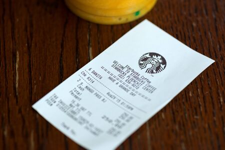 BANGKOK, THAILAND - AUGUST 29, 2015: Mango juice and check in coffee shop in downtown of Bangkok.