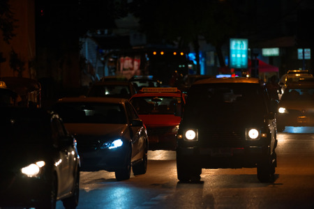 BANGKOK, THAILAND - AUGUST 24, 2016: Road traffic on the street in downtown of Bangkok. Night time.のeditorial素材