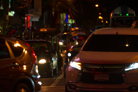 BANGKOK, THAILAND - AUGUST 25, 2016: Road traffic in night time on the street in downtown of...