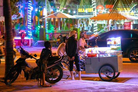 DA NANG, VIETNAM - JULY 30, 2017: Beautiful public beach located in Da Nang city. Tourists and locals are walking and resting in the relaxed atmosphere near the ocean.のeditorial素材