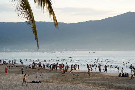 DA NANG, VIETNAM - JULY 31, 2017: Calm and peaceful beach of Da Nang city. Tourists and locals are walking and resting in the relaxed atmosphere of this city. Da Nang is a Vietnamese resort famous for its beaches.のeditorial素材