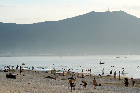 DA NANG, VIETNAM - JULY 31, 2017: Calm and peaceful beach of Da Nang city. Tourists and locals are walking and resting in the relaxed atmosphere of this city. Da Nang is a Vietnamese resort famous for its beaches.のeditorial素材