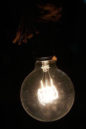 Stylish vintage electric lamp in the dark room.の写真素材