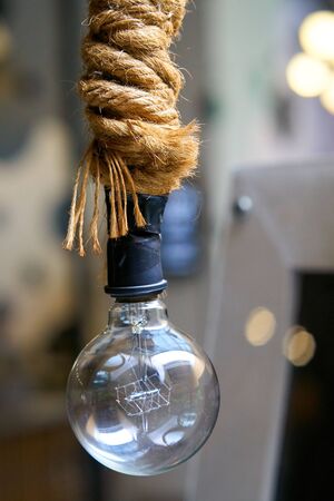 Stylish vintage electric lamp in the dark room.の写真素材