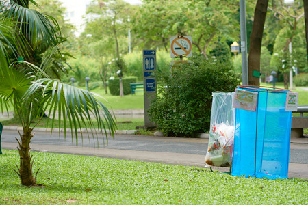 BANGKOK, THAILAND - July 5, 2017: Trash cans in the beautiful tropical park in Bangkok, Thailand.のeditorial素材