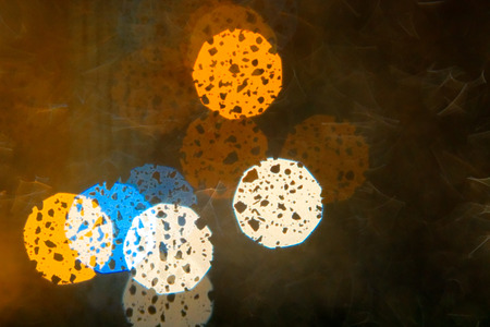Abstract out of focus background. View through the window glass in rainy weather.