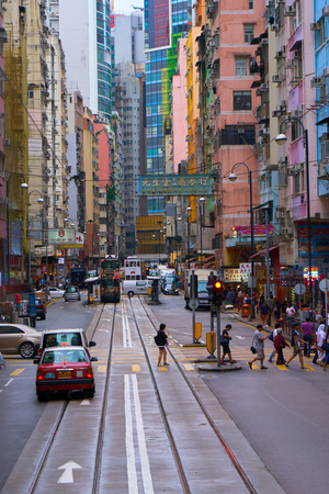 HONG KONG - September 4, 2017: Tramway tracks and high rise residential buildings on Des Voeux road. Street scene in Hong Kong.