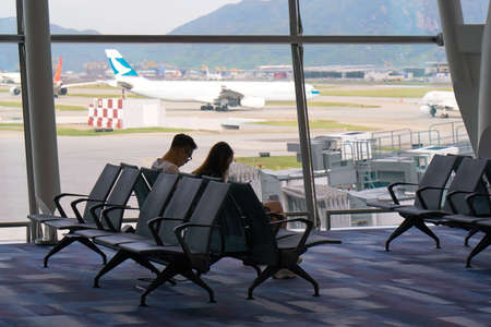 HONG KONG - SEPTEMBER 6, 2017: Passengers are waiting their departure in the HK Airport (HKG) - Chek Lap Kok.のeditorial素材