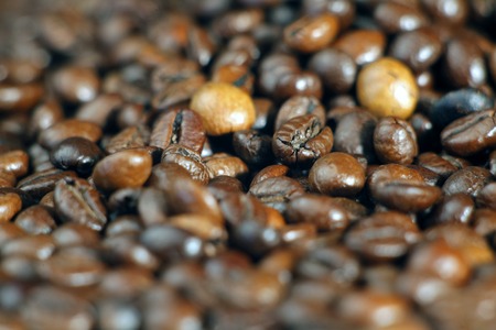 Roasted coffee beans on the table closeupの写真素材