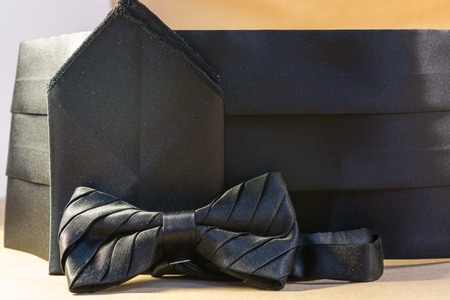 Black bow tie with a sash and a handkerchief for a suit for the evening ballの写真素材