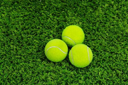 Close up of tennis ball on grassの写真素材