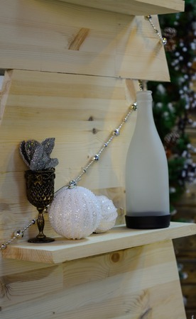 Wooden shelves with antiques things and christmas toyの写真素材