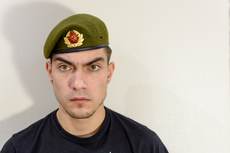 young soldier in a green beret intelligenceの写真素材