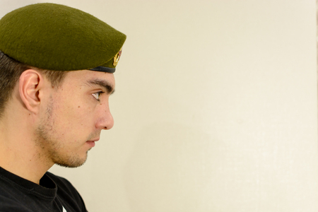 young soldier in a green beret intelligenceの写真素材