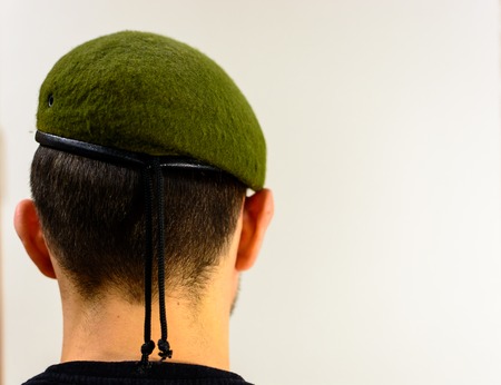 young soldier in a green beret intelligenceの写真素材