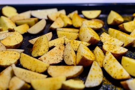 Baked spiced potatoesの写真素材