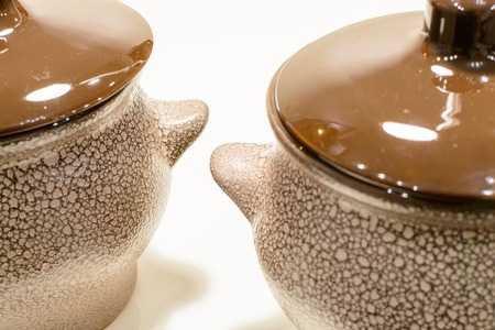 Two brown earthen pot on white backgroundの写真素材