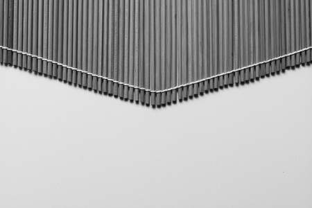 Closeup of bamboo mat with white background, tonedの写真素材