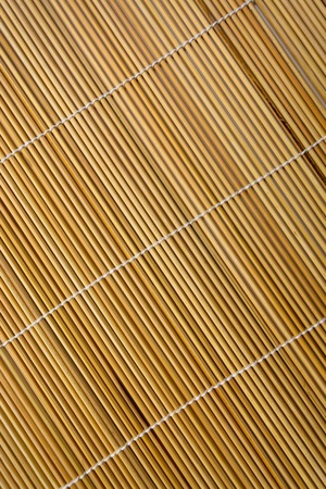 Closeup of bamboo mat with white backgroundの写真素材