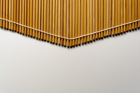 Closeup of bamboo mat with white backgroundの写真素材